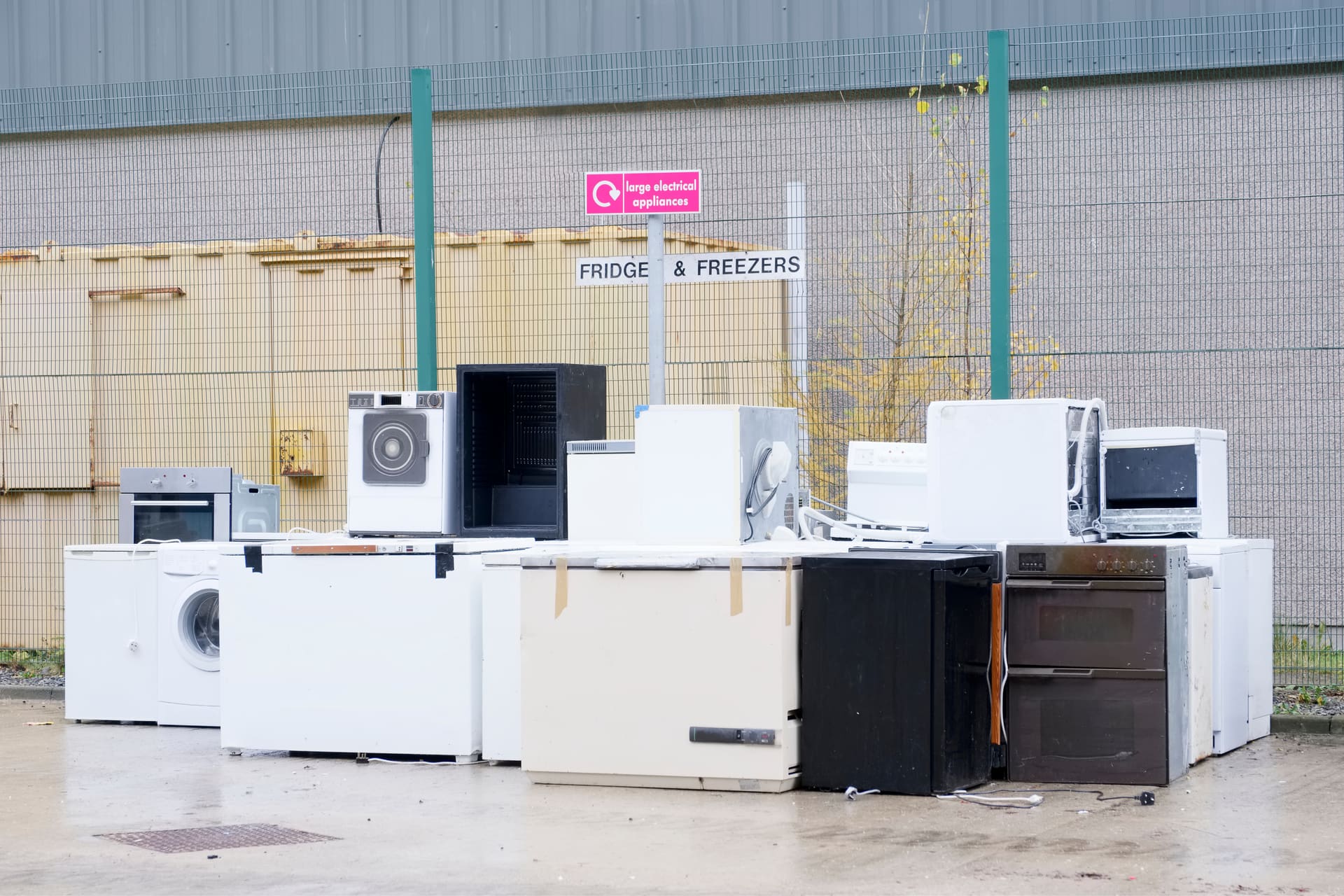 Various household appliances awaiting free pickup and recycling